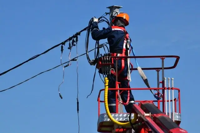 Electrician working on power lines